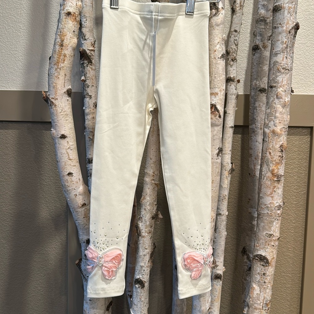Mae Li Rose cream leggings with embellishments on bottom. Size 5/6